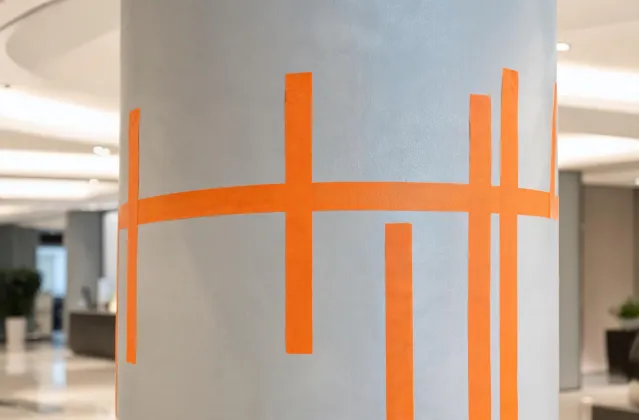 Crisp paint masking on commercial lobby column